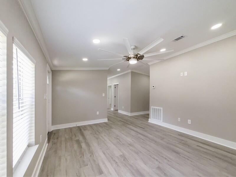630 West Griffith Avenue Crestview, FL 32536 - Photo 7 of 36 wooden floor in an empty room with a window