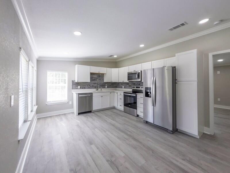 630 West Griffith Avenue Crestview, FL 32536 - Photo 10 of 36 a kitchen with a refrigerator a sink a stove a microwave and cabinets