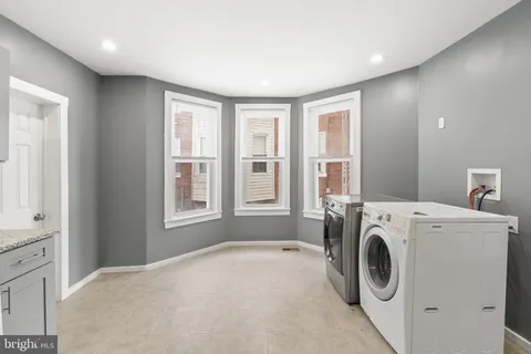 a view of a kitchen with washer and dryer