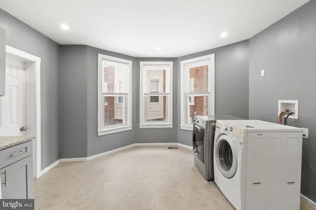 a view of a kitchen with washer and dryer