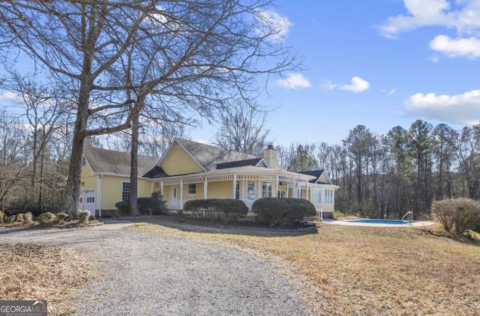 1776 Wax Road Southeast Silver Creek, GA 30173 - Photo 1 of 45 a front view of a house with a yard and trees