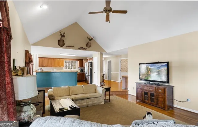 a living room with furniture and a flat screen tv