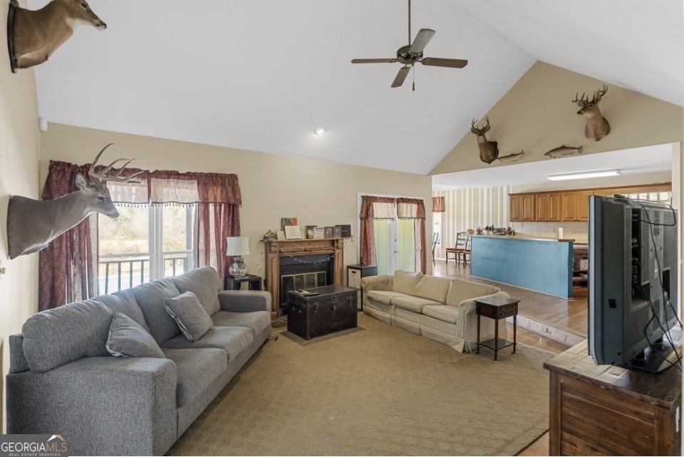 1776 Wax Road Southeast Silver Creek, GA 30173 - Photo 12 of 45 a living room with furniture flat screen tv and a fireplace