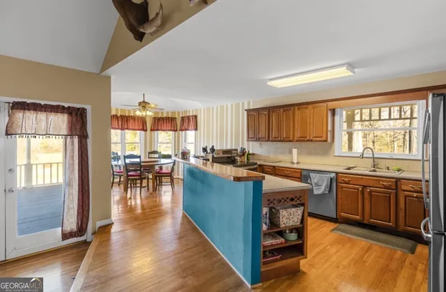 a kitchen with lots of counter top space and dining table