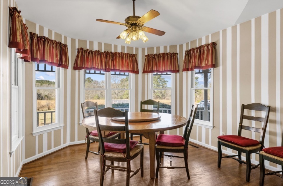 1776 Wax Road Southeast Silver Creek, GA 30173 - Photo 18 of 45 a view of a dining room with furniture window and wooden floor