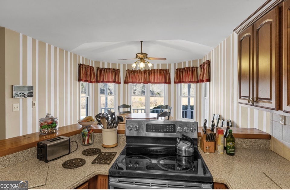 1776 Wax Road Southeast Silver Creek, GA 30173 - Photo 19 of 45 a living room with furniture and a chandelier