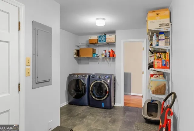 a utility room with dryer and washer