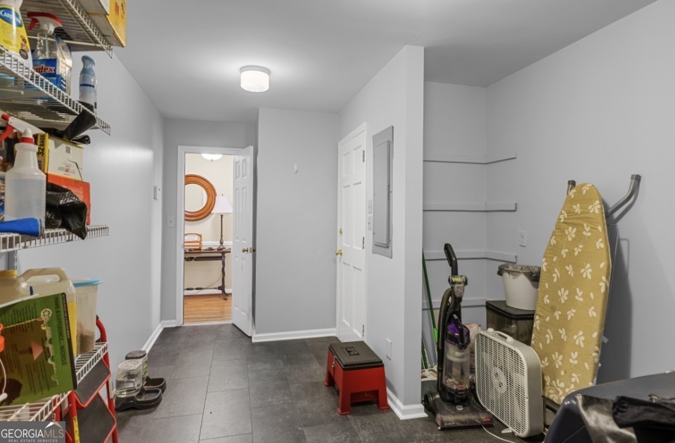 1776 Wax Road Southeast Silver Creek, GA 30173 - Photo 24 of 45 a view of walk in closet with clothes and shoes
