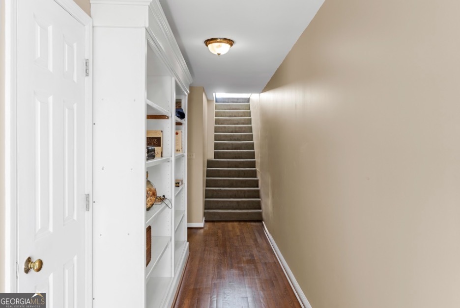 1776 Wax Road Southeast Silver Creek, GA 30173 - Photo 28 of 45 a view of a hallway with wooden floor and stairs
