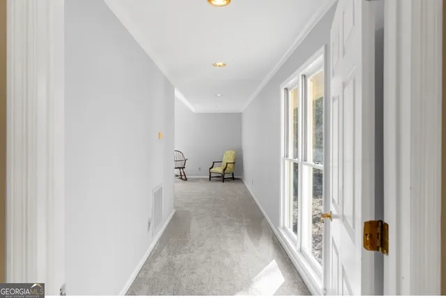 a view of a hallway with a window