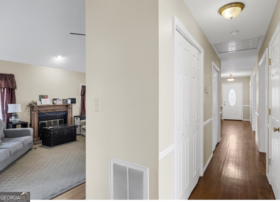 1776 Wax Road Southeast Silver Creek, GA 30173 - Photo 38 of 45 a view of a hallway with wooden floor