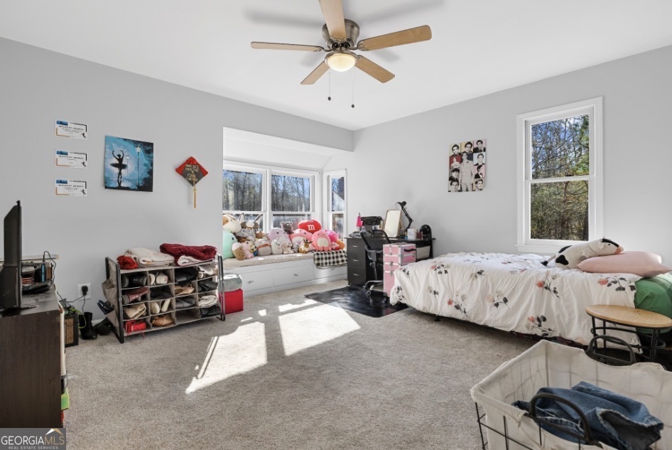 1776 Wax Road Southeast Silver Creek, GA 30173 - Photo 39 of 45 a bedroom with bed and a large window
