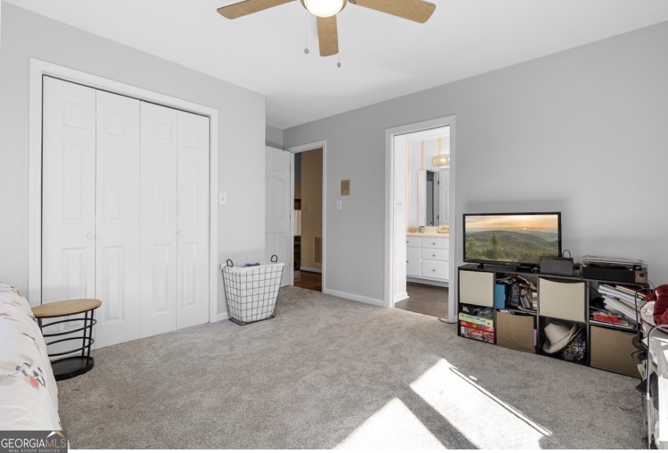 1776 Wax Road Southeast Silver Creek, GA 30173 - Photo 40 of 45 a living room with furniture and a flat screen tv