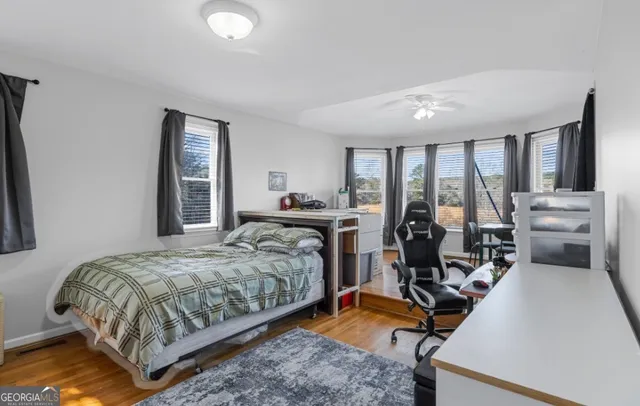 a bedroom with a bed and a table