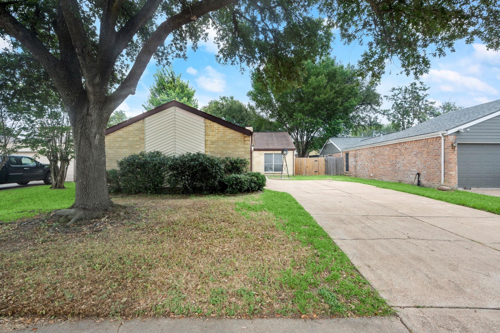 11718 Ridge Run Drive Houston, TX 77064 - Photo 2 of 17 a front view of a house with garden