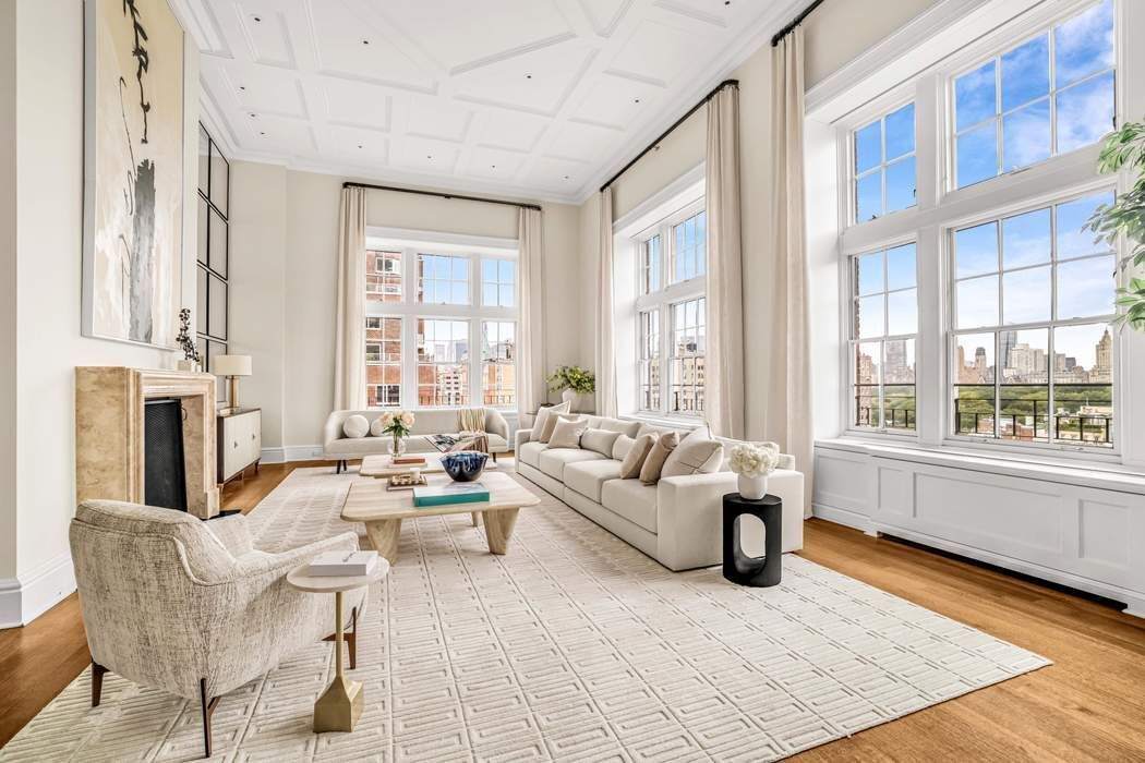 39 East 79th Street, Unit TRIPLEX 12/13/14 Manhattan, NY 10075 - Photo 1 of 33 a living room with fireplace furniture and a large window