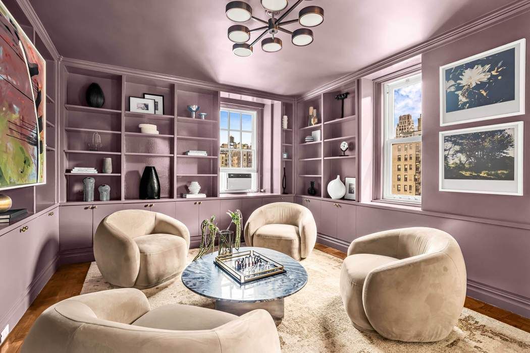 39 East 79th Street, Unit TRIPLEX 12/13/14 Manhattan, NY 10075 - Photo 11 of 33 a living room with furniture and a window