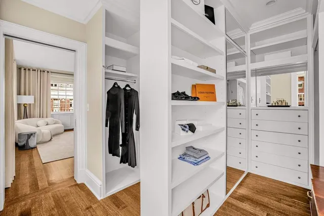 a bed room with two beds and a large window