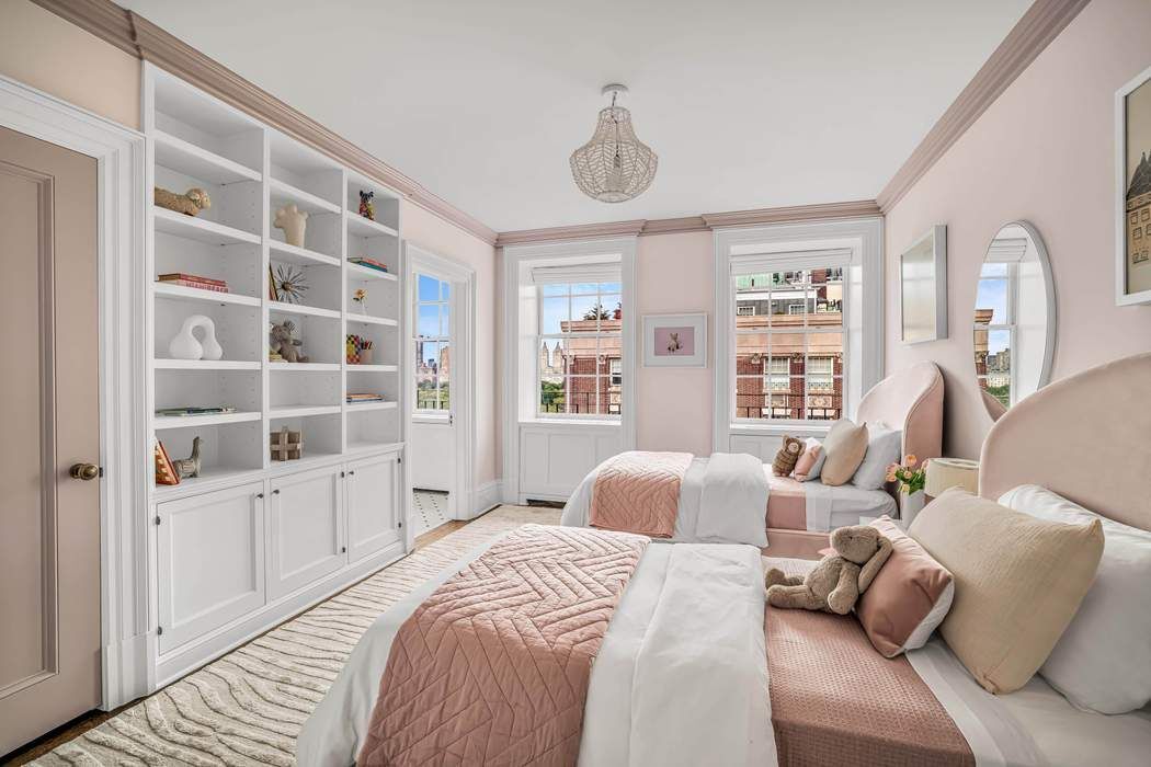 39 East 79th Street, Unit TRIPLEX 12/13/14 Manhattan, NY 10075 - Photo 19 of 33 a bedroom with furniture and a window