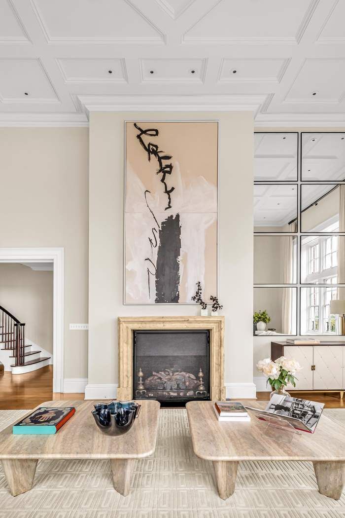 39 East 79th Street, Unit TRIPLEX 12/13/14 Manhattan, NY 10075 - Photo 2 of 33 a living room with furniture and a fireplace