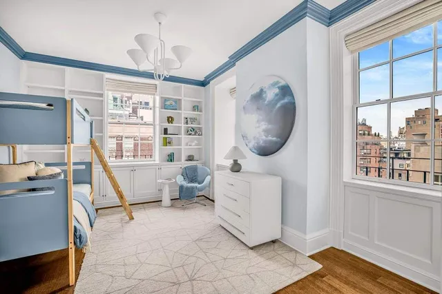 a bathroom with a sink a toilet and a window