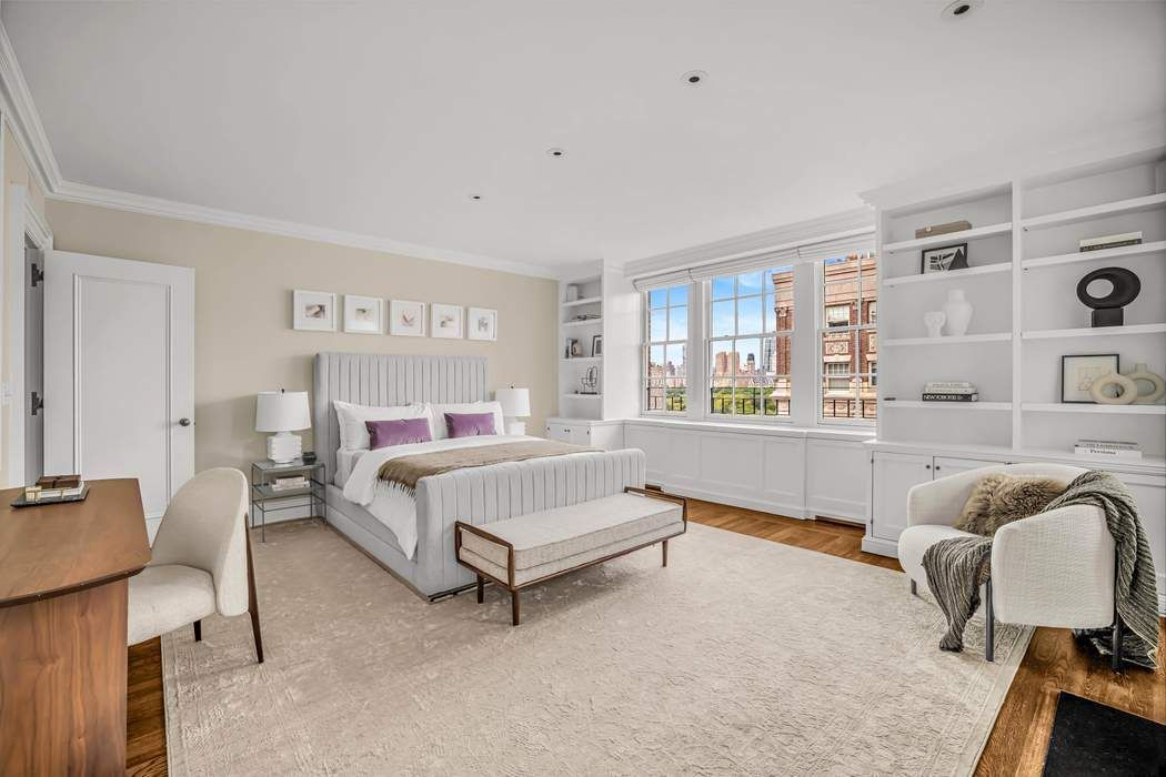 39 East 79th Street, Unit TRIPLEX 12/13/14 Manhattan, NY 10075 - Photo 24 of 33 a bedroom with furniture and a window