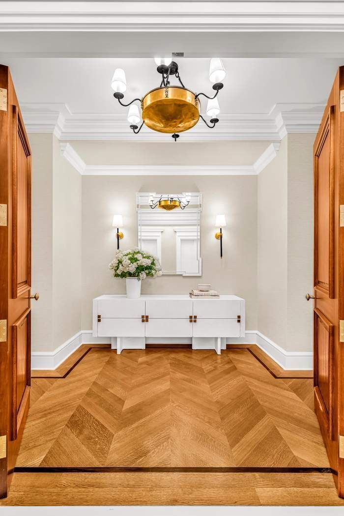 39 East 79th Street, Unit TRIPLEX 12/13/14 Manhattan, NY 10075 - Photo 29 of 33 a living room with granite countertop furniture and a rug