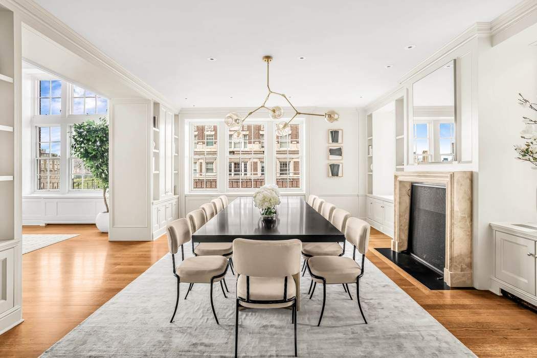 39 East 79th Street, Unit TRIPLEX 12/13/14 Manhattan, NY 10075 - Photo 3 of 33 a dining room with furniture a chandelier and wooden floor