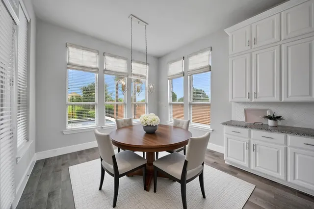a view of kitchen with cabinets and wooden floor