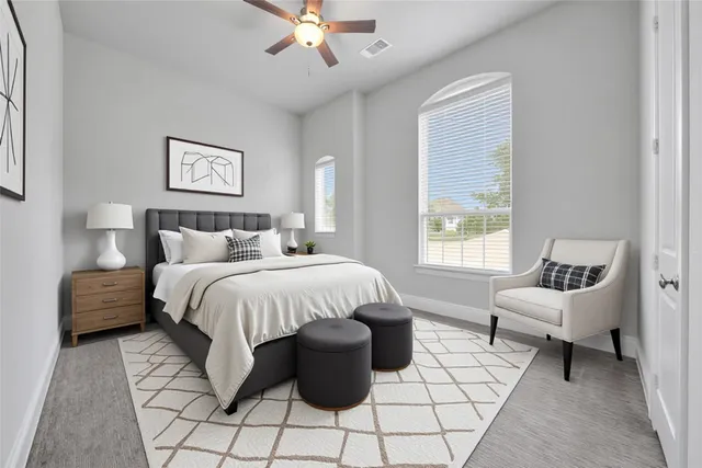 a bathroom with a granite countertop sink a toilet and shower