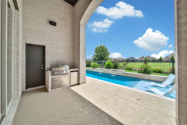 an empty room with a window and a ceiling fan