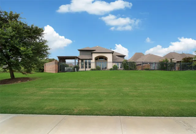 a view of a brick house with a barbeque