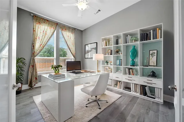 a view of entryway and hall with wooden floor