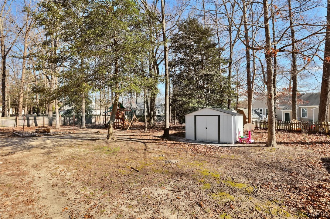 9905 Brenspark Road Chesterfield, VA 23832 - Photo 19 of 19 a white house that has a tree in front of it