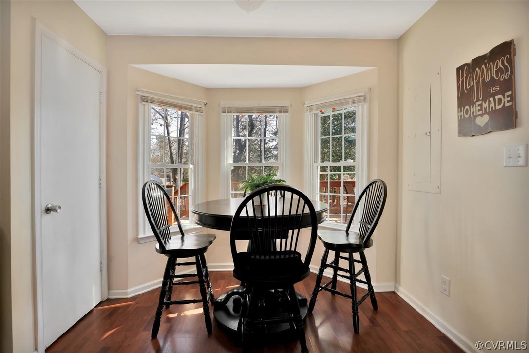 9905 Brenspark Road Chesterfield, VA 23832 - Photo 9 of 19 a view of a dining room with furniture window and wooden floor