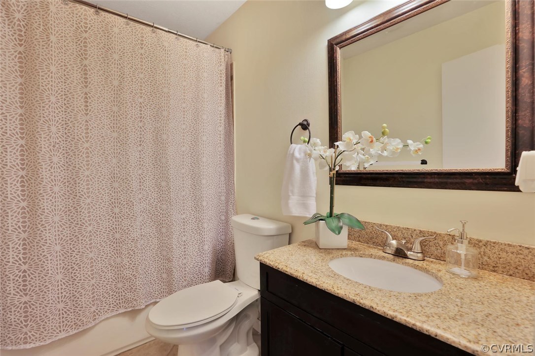 9905 Brenspark Road Chesterfield, VA 23832 - Photo 10 of 19 a bathroom with a granite countertop sink and a mirror with toilet