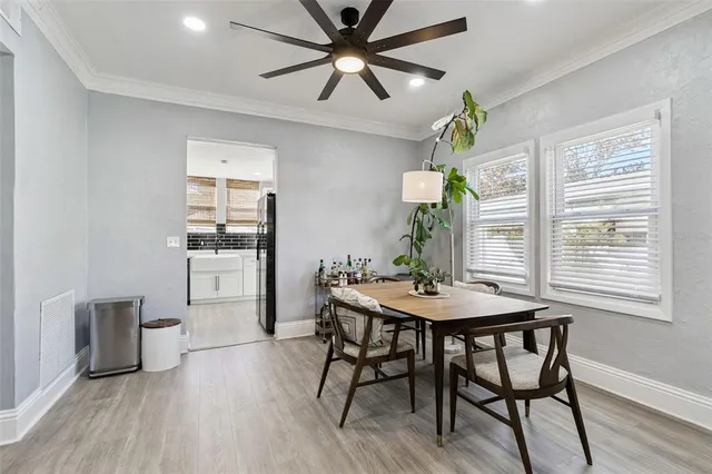 a view of a dining room with furniture and window