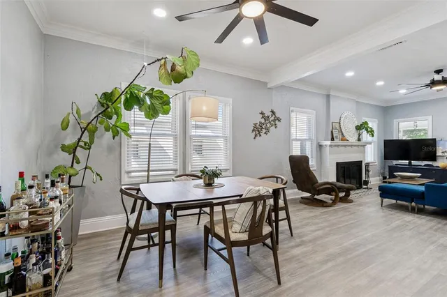 a view of a dining room with furniture window and wooden floor