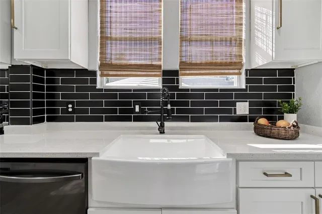 a bathroom with a sink and a window