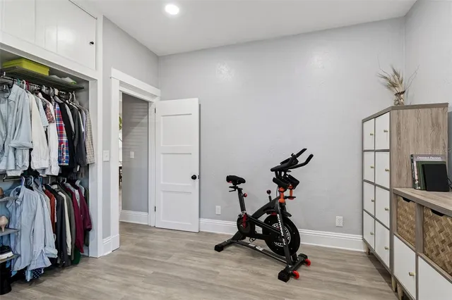 a bedroom with furniture and a window