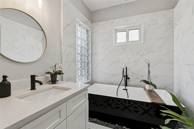 a view of a balcony with a potted plant and wooden floor