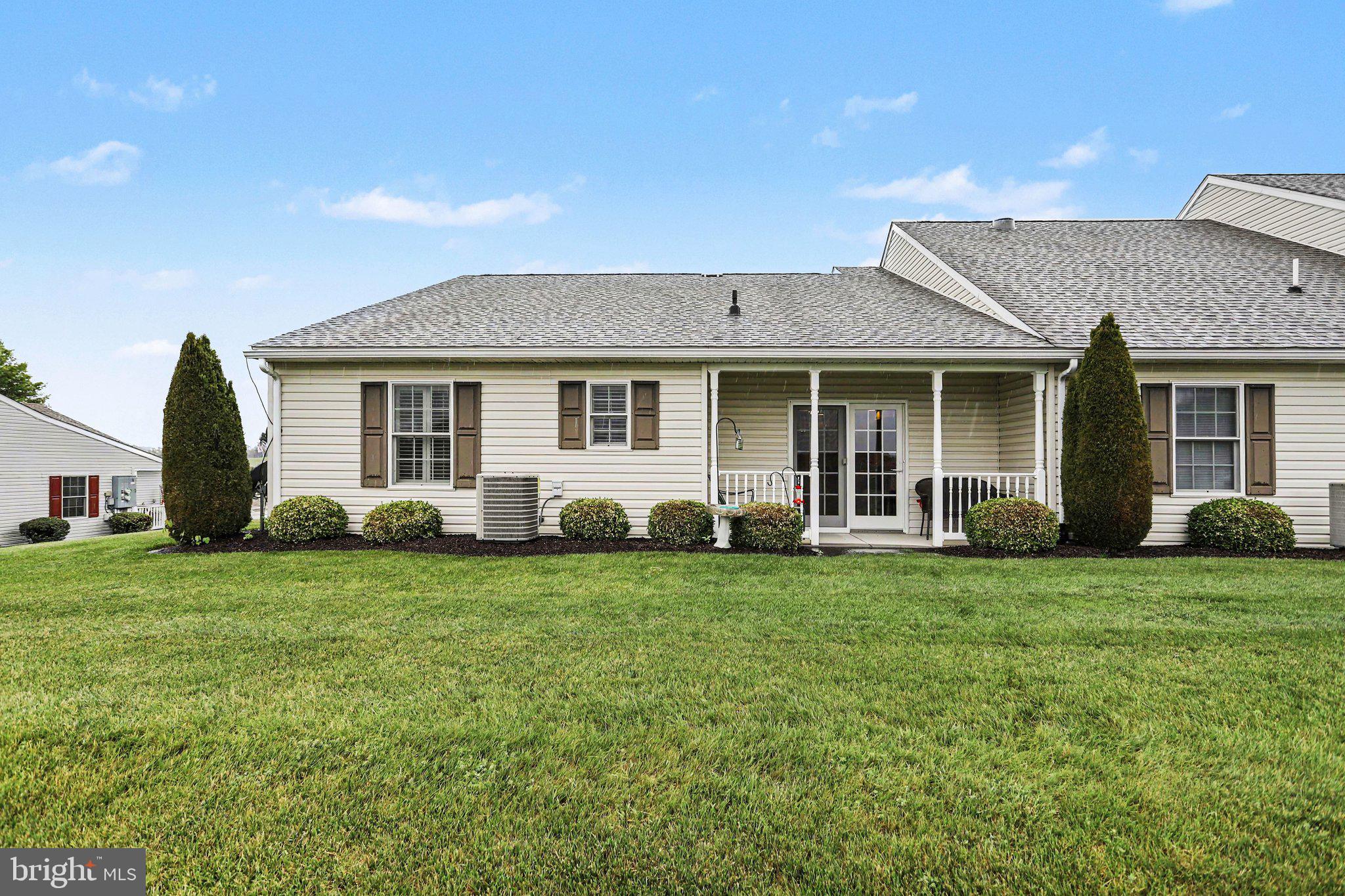1371 Chami Drive, Unit 166 Spring Grove, PA 17362 - Photo 27 of 28 a front view of a house with a garden