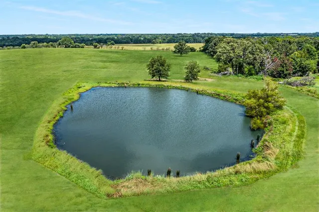 a view of a lake with a yard