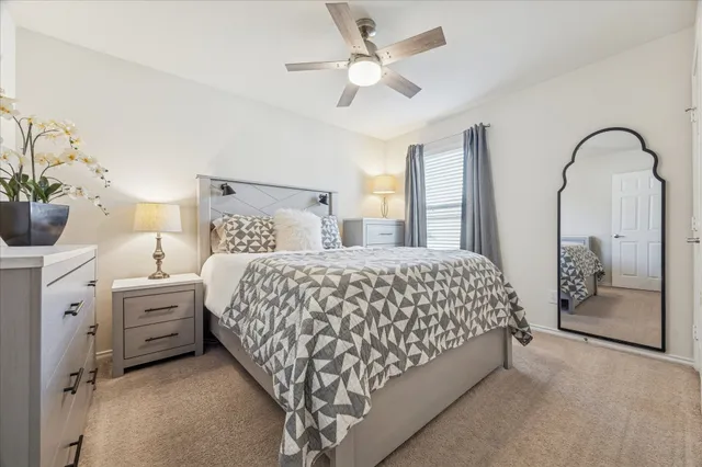 a bed room with a bed and a chandelier