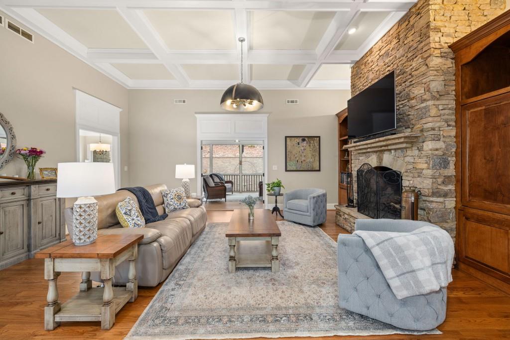 99 Madeline Anthony Road Dahlonega, GA 30533 - Photo 11 of 60 a living room with furniture a fireplace and a flat screen tv