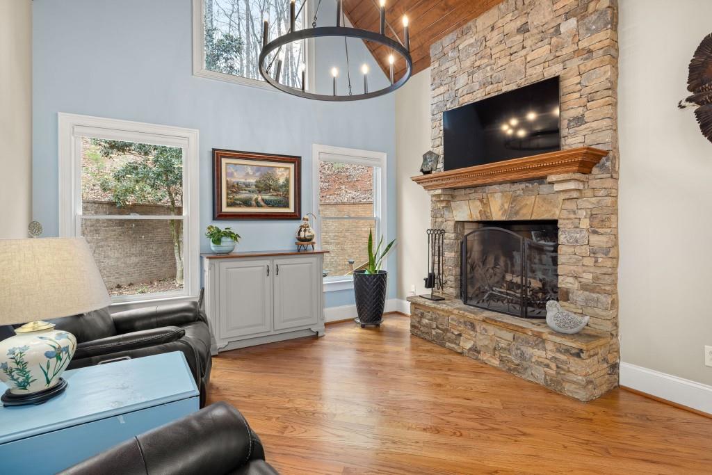 99 Madeline Anthony Road Dahlonega, GA 30533 - Photo 19 of 60 a living room with furniture a flat screen tv and a fireplace