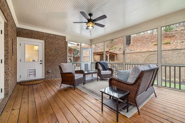 a spacious bedroom with a bed and wooden floor