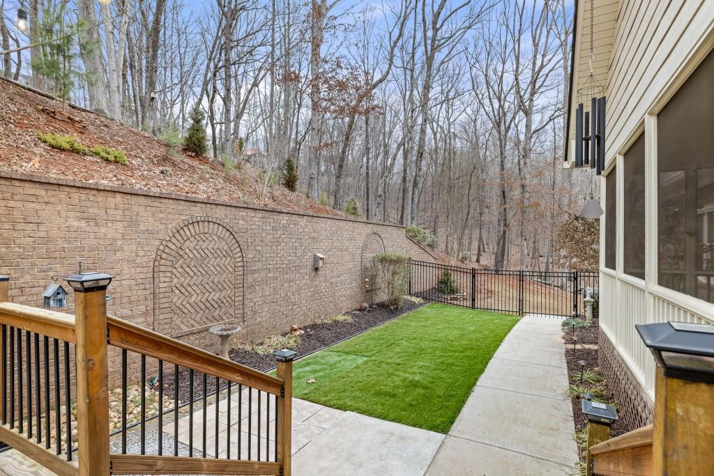 99 Madeline Anthony Road Dahlonega, GA 30533 - Photo 23 of 60 a view of a brick wall in front of a house