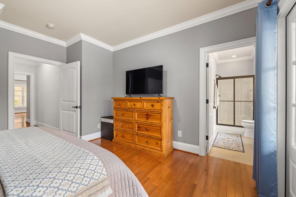 99 Madeline Anthony Road Dahlonega, GA 30533 - Photo 32 of 60 a bedroom with a bed and flat screen tv