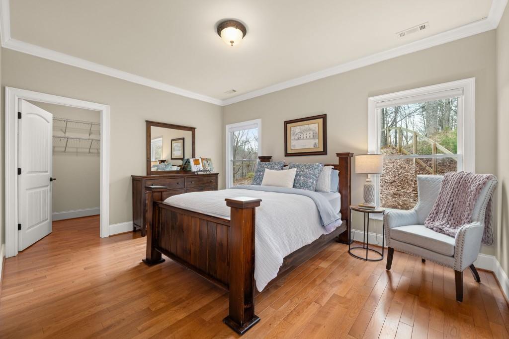 99 Madeline Anthony Road Dahlonega, GA 30533 - Photo 34 of 60 a bedroom with a bed and a chair